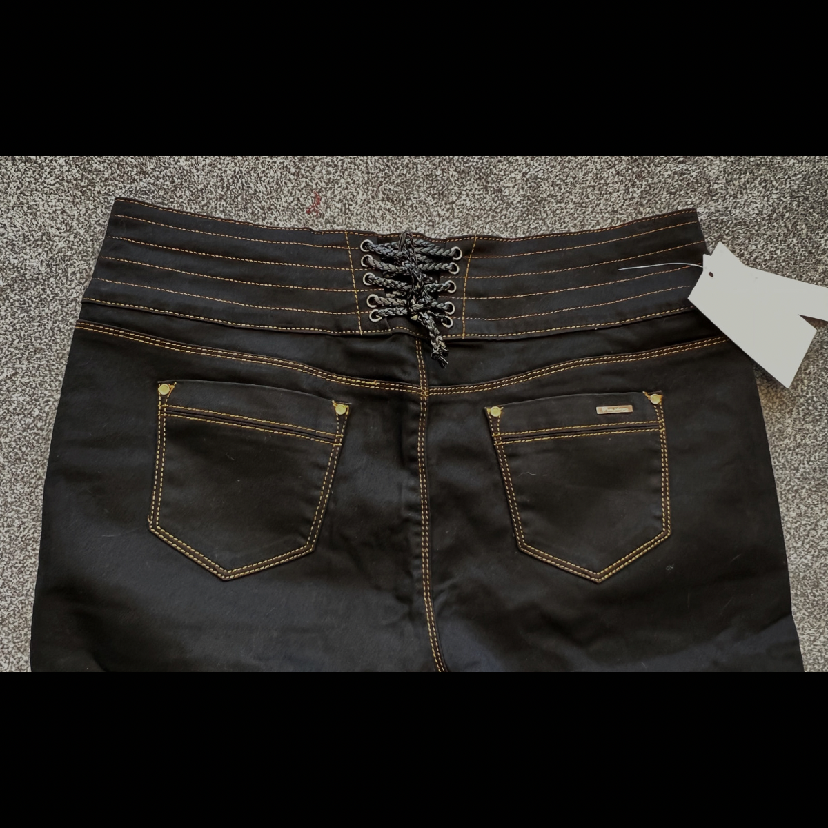 BLACK STRETCH HIGH WAIST JEANS WITH GOLD BUTTONS AND LATTICE WAIST